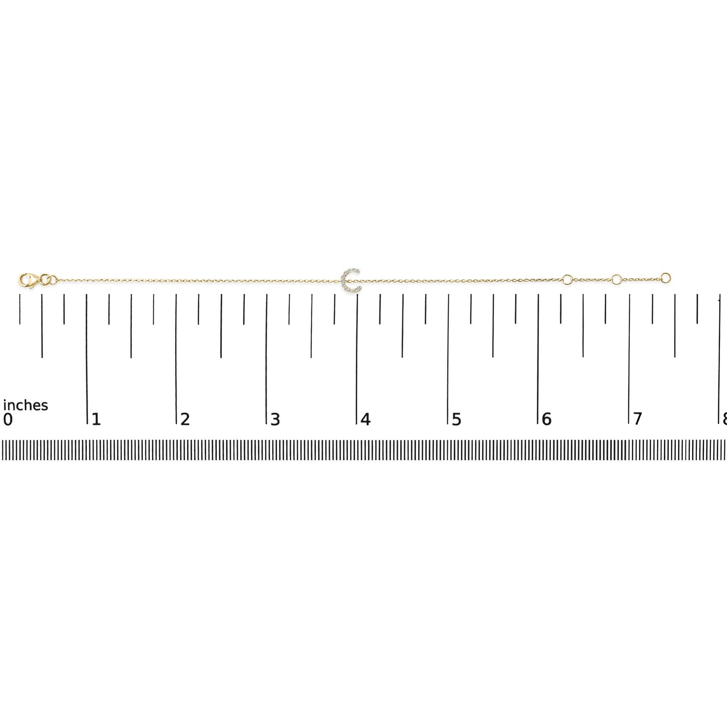 Yellow bracelet with a crescent-shaped centerpiece featuring small round white gemstones in a micro-pave setting, shown flat on a ruler scale from a top-down view.
