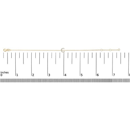 Yellow bracelet with a crescent-shaped centerpiece featuring small round white gemstones in a micro-pave setting, shown flat on a ruler scale from a top-down view.