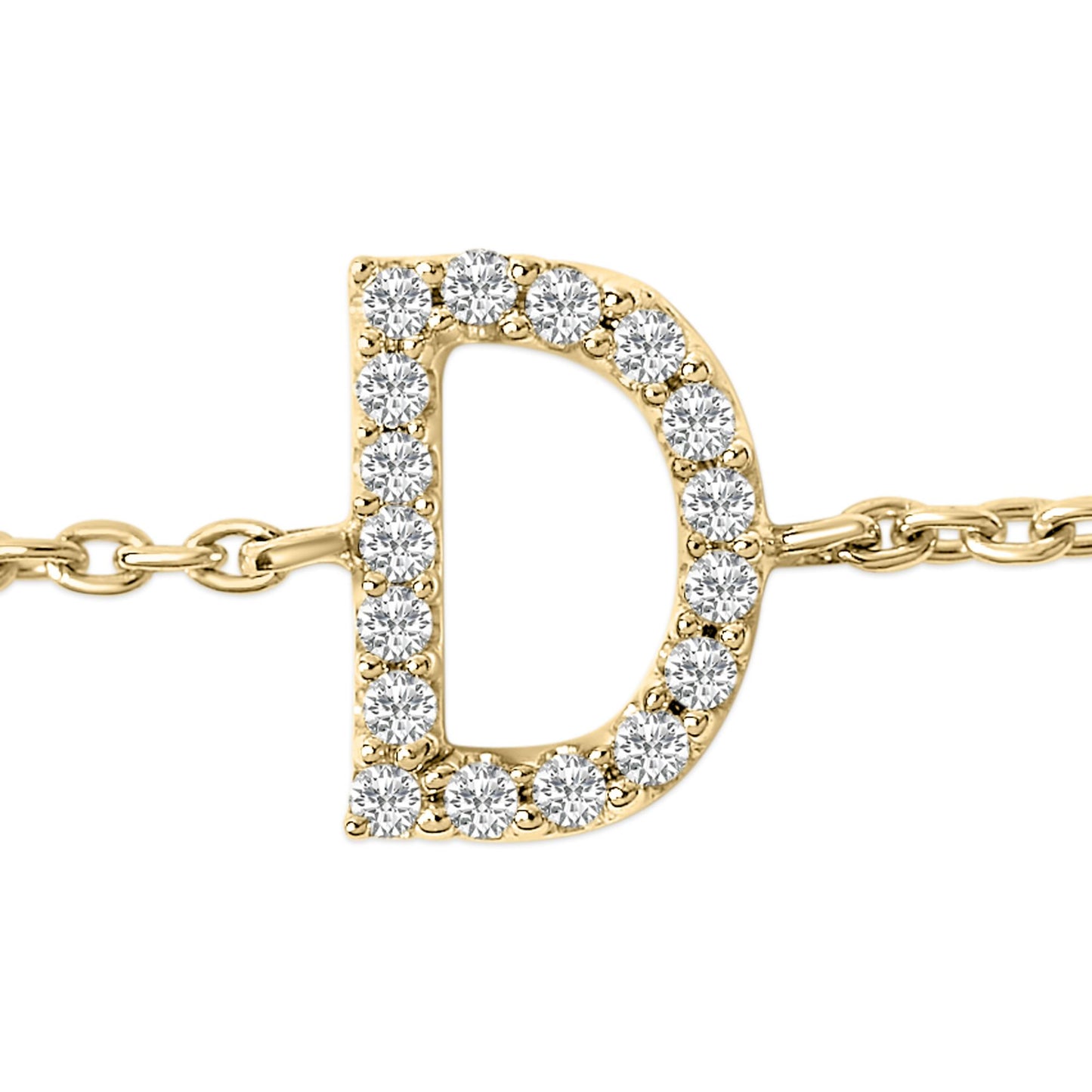 Close-up front angle of a yellow metal bracelet featuring a capital letter 'D' adorned with round white gemstones in a micro-pave setting.