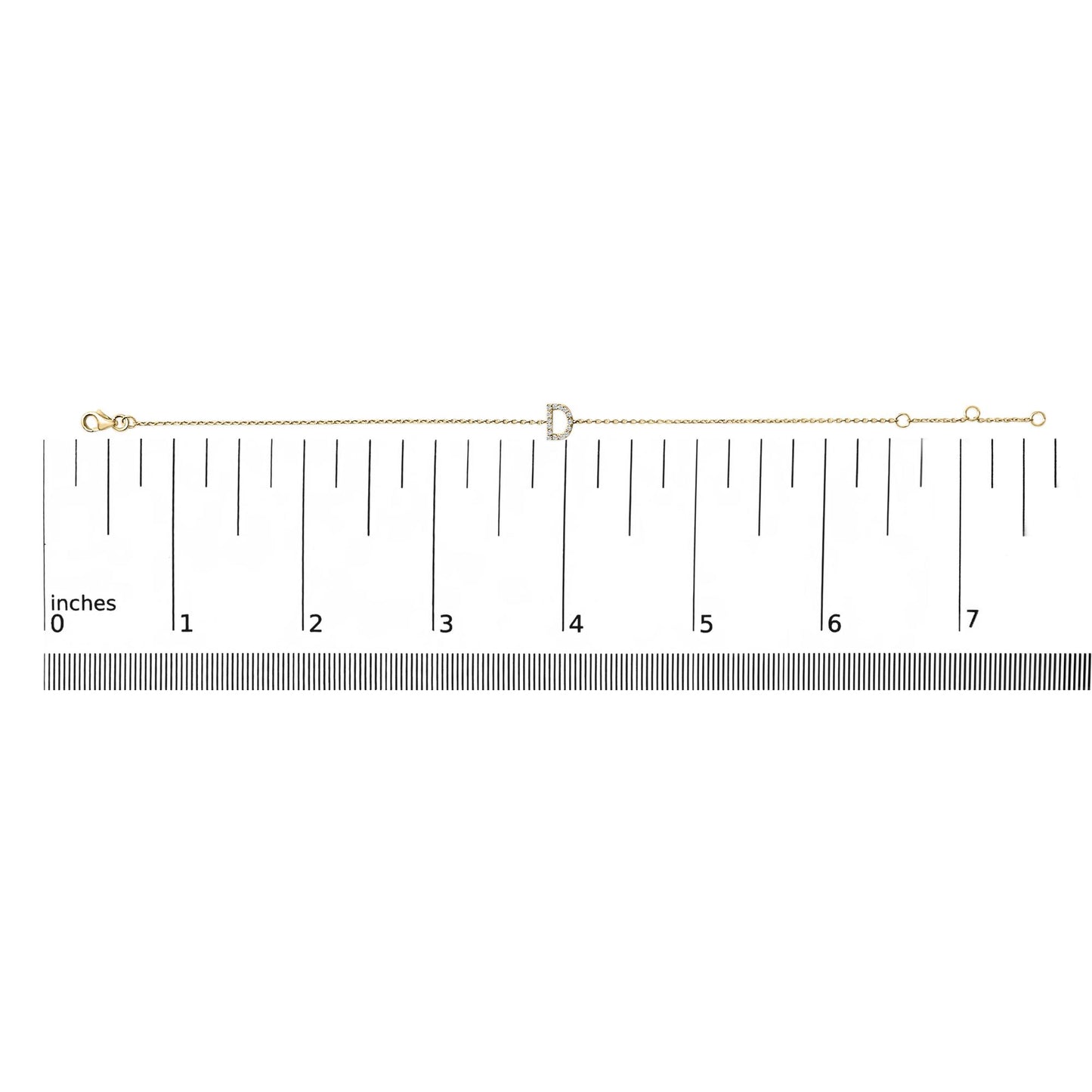 Yellow bracelet with a letter-shaped centerpiece adorned with small white gemstones in a micro-pave setting, displayed on a scale from a top-down angle.
