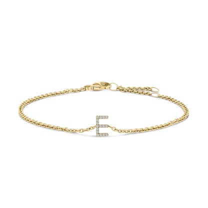 Bracelet with yellow metal chain and clasp, featuring a centered letter E adorned with small white gemstones, shown from a front flat angle on a white background.