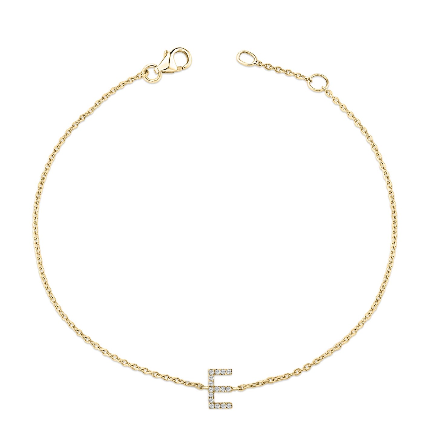 Close-up top view of a delicate yellow metal bracelet with a chain and an 'E' shaped charm adorned with white round gemstones in a micro-pave setting.