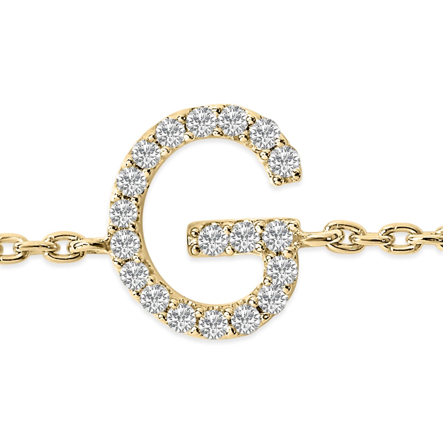 Close-up shot of a yellow metal bracelet featuring a letter G pendant adorned with white round gemstones in a micro-pave setting, shown from the front.