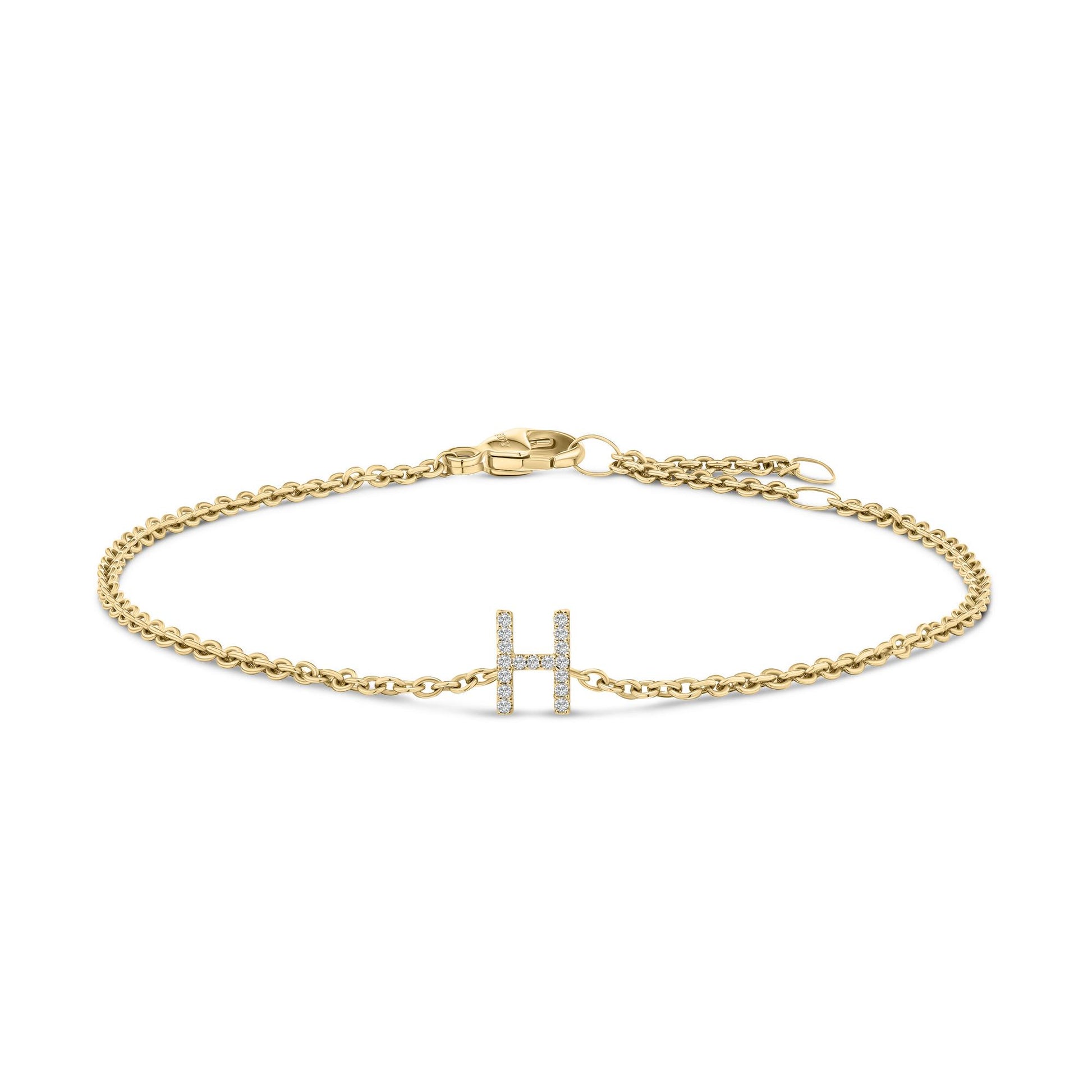 Yellow metal bracelet with a chain link design and an 'H' shaped centerpiece adorned with round white gemstones in a micro-pave setting, shown from a front angle on a white background.