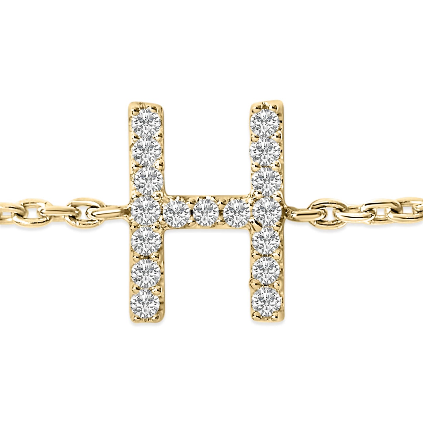 Close-up front view of a yellow metal bracelet with a horizontal and vertical bar design forming an 'H' shape, encrusted with small white round gemstones in a micro-pave setting.