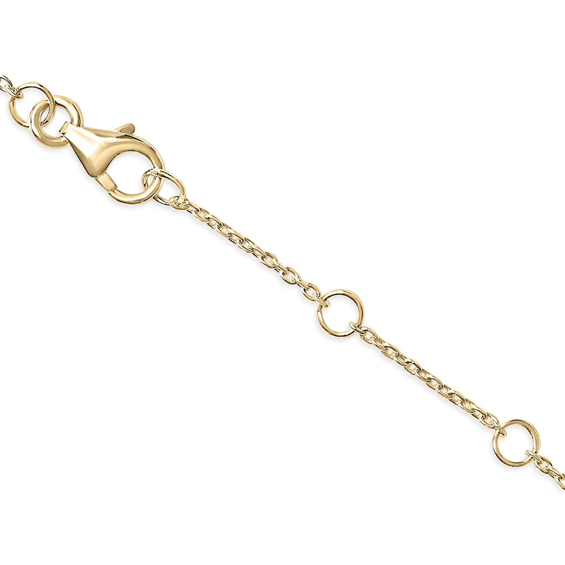Close-up angled view of a yellow metal bracelet chain segment with a clasp and circular links, showing white round gemstones in a micro-pave setting.