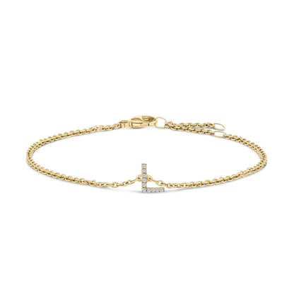 Yellow metal bracelet with an L-shaped pendant featuring white round gemstones in a micro-pave setting, shown from a front angle on a white background.