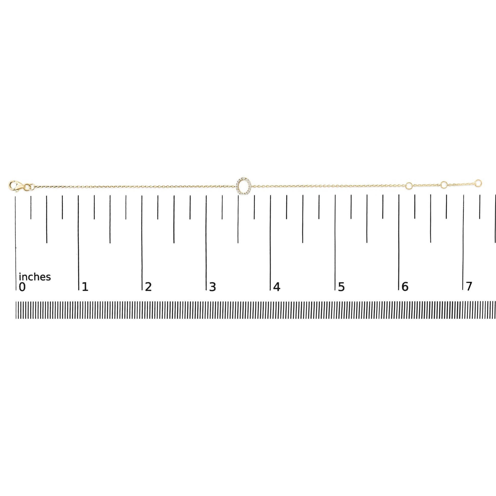 Yellow bracelet with a circular center decorated with white round gemstones in a micro-pave setting, shown flat on a horizontal scale, top-down view.