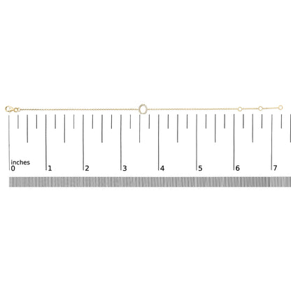Yellow bracelet with a circular center decorated with white round gemstones in a micro-pave setting, shown flat on a horizontal scale, top-down view.