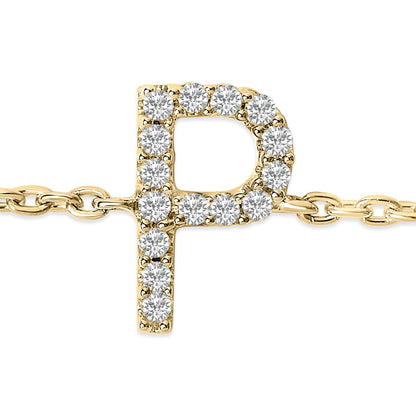 Close-up front view of a yellow metal bracelet featuring a letter 'P' pendant adorned with round white gemstones in a micro-pave setting.