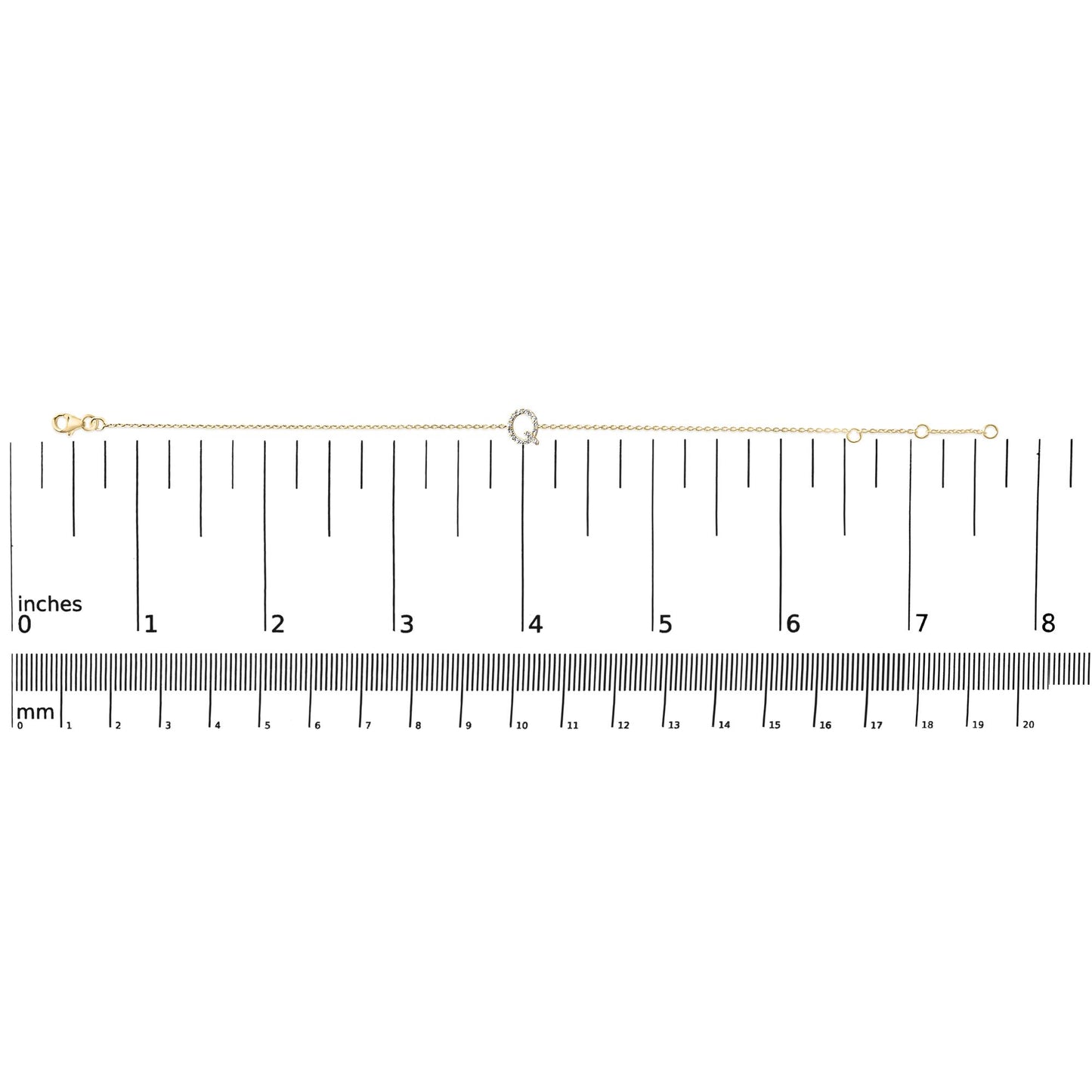 Yellow metal delicate bracelet with a small circular centerpiece set with white gemstones, shown laid flat on a scale, top-down view.