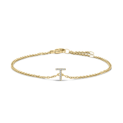 Yellow metal chain bracelet with a T-shaped centerpiece set with small white gemstones, shown from the front on a white background.