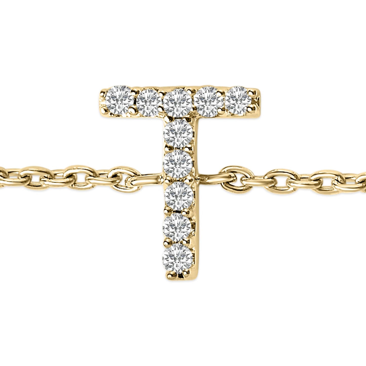 Close-up front view of a yellow metal bracelet with a T-shaped charm set with white round gemstones in a micro-pave setting, shown on a chain.