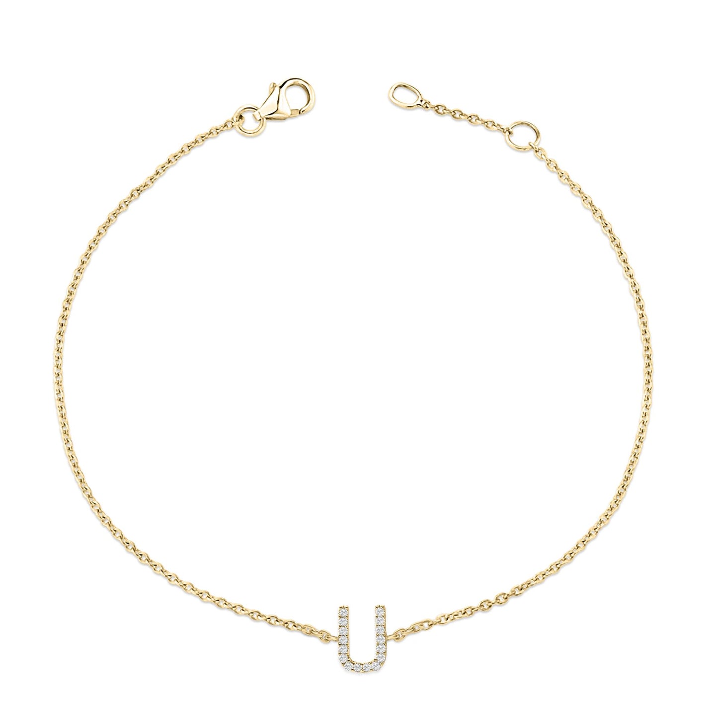 Top-down view of a yellow metal chain bracelet with a U-shaped charm adorned with small white gemstones in a micro-pave setting.