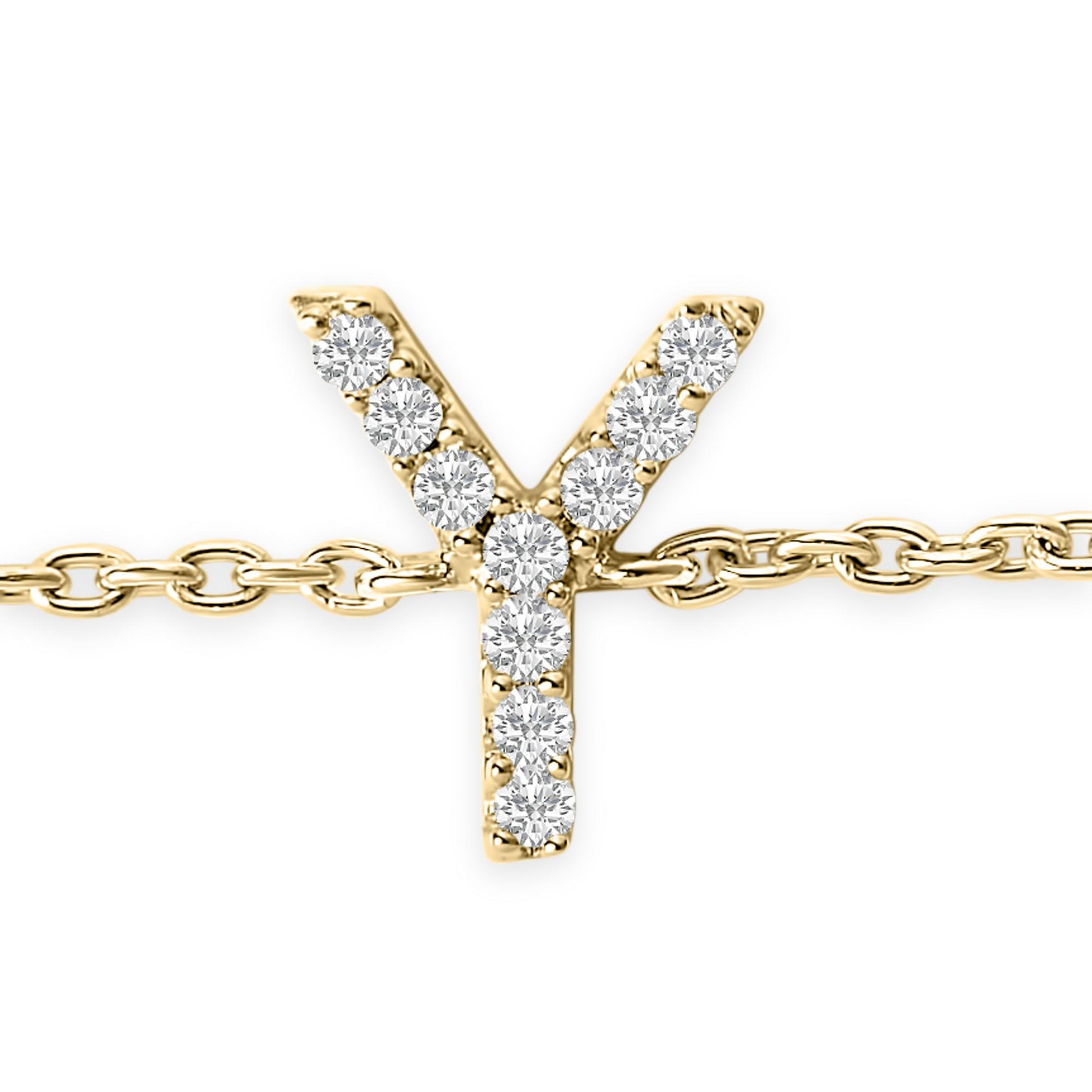 Close-up front view of a yellow metal bracelet with a Y-shaped charm adorned with round white gemstones in a micro-pave setting.
