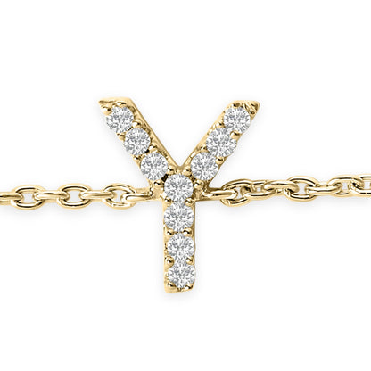 Close-up front view of a yellow metal bracelet with a Y-shaped charm adorned with round white gemstones in a micro-pave setting.