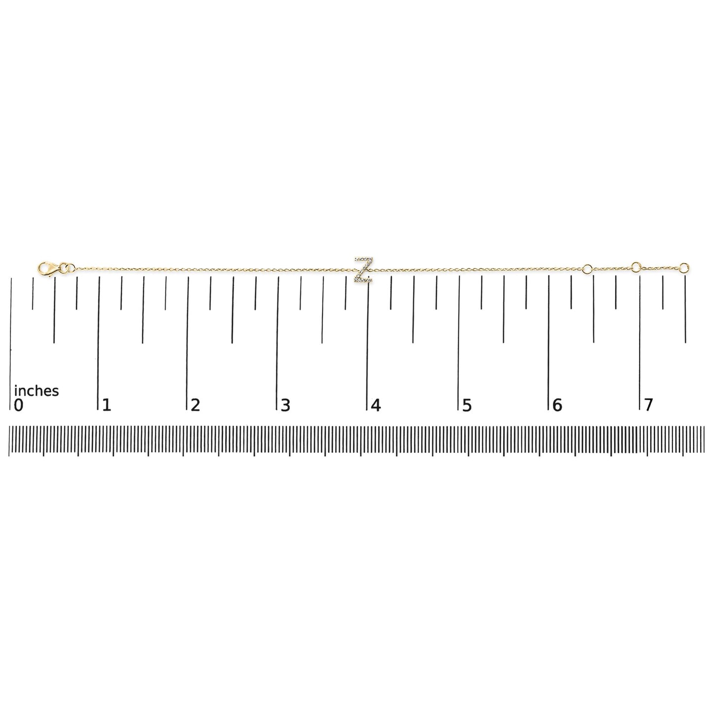 Yellow metal bracelet with a letter 'Z' charm set with white round gemstones in micro-pave setting, displayed flat on a scale, top-down view.