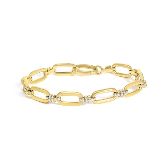 Angled view of 14K yellow gold 1 1/10 Cttw diamond cluster paperclip link bracelet showcasing polished links with a white background