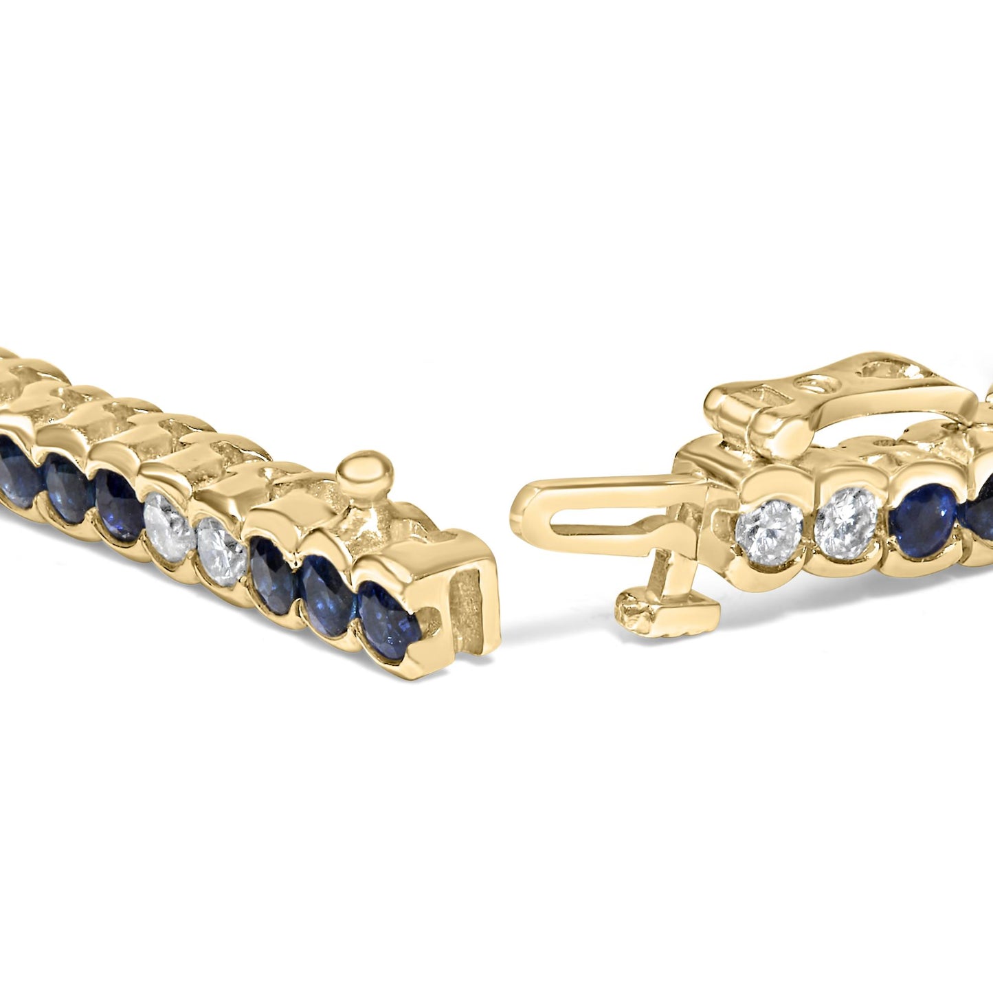 Close-up angle of an open yellow metal bracelet featuring alternating round blue and white gemstones in bezel settings.