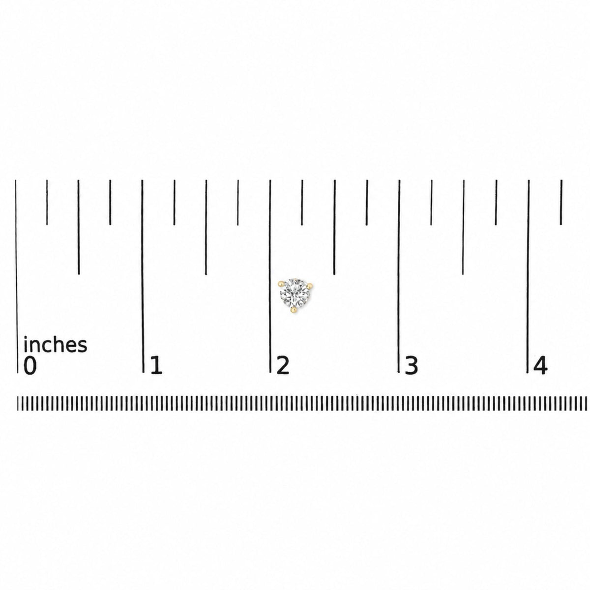 Pair of yellow metal stud earrings with round white gemstones in 3-prong settings, shown on a ruler scale from a top-down angle.
