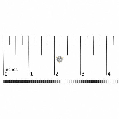 Pair of yellow metal stud earrings with round white gemstones in 3-prong settings, shown on a ruler scale from a top-down angle.