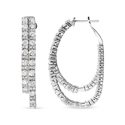 Pair of white metal hoop earrings with prong-set round white gemstones, shown from front and side angle.