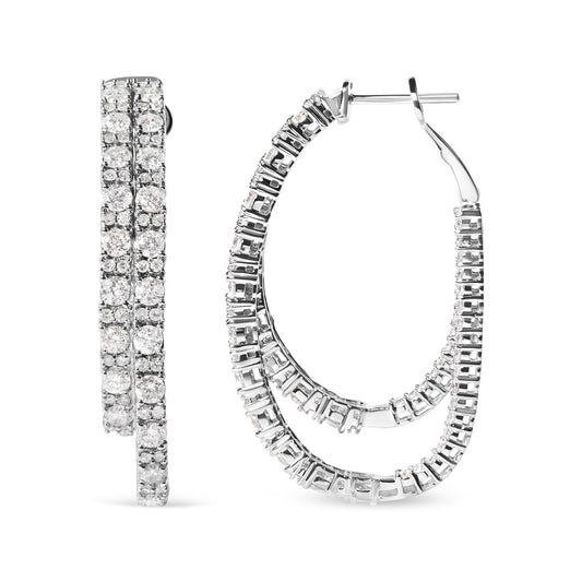 Pair of white metal hoop earrings with prong-set round white gemstones, shown from front and side angle.