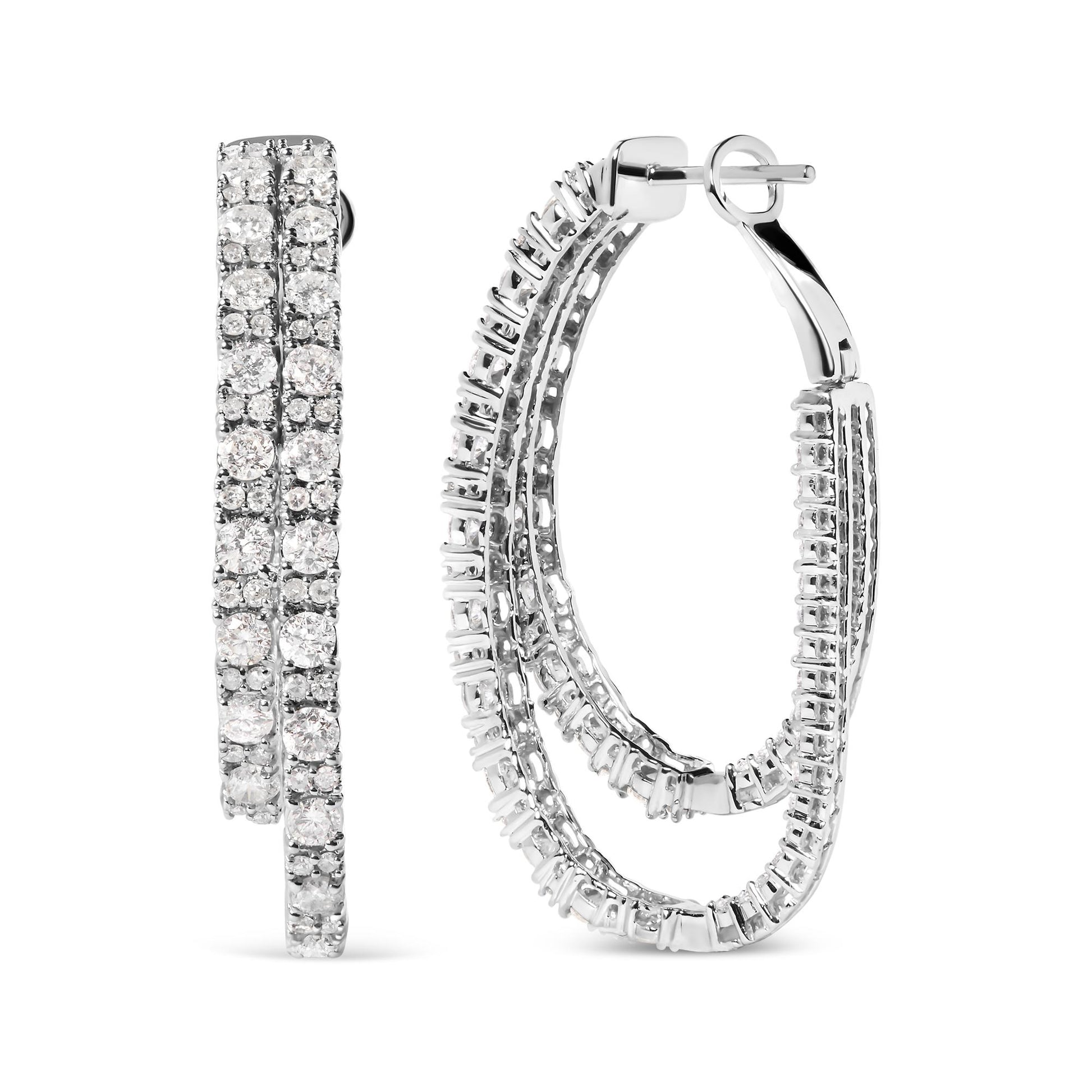 Pair of white metal hoop earrings with multiple rows of round white gemstones in prong settings, shown from the front and side angles.