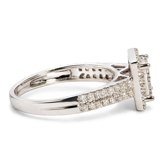 Close-up side view of a white metal ring with a split shank design, featuring multiple rows of round white gemstones in prong settings.