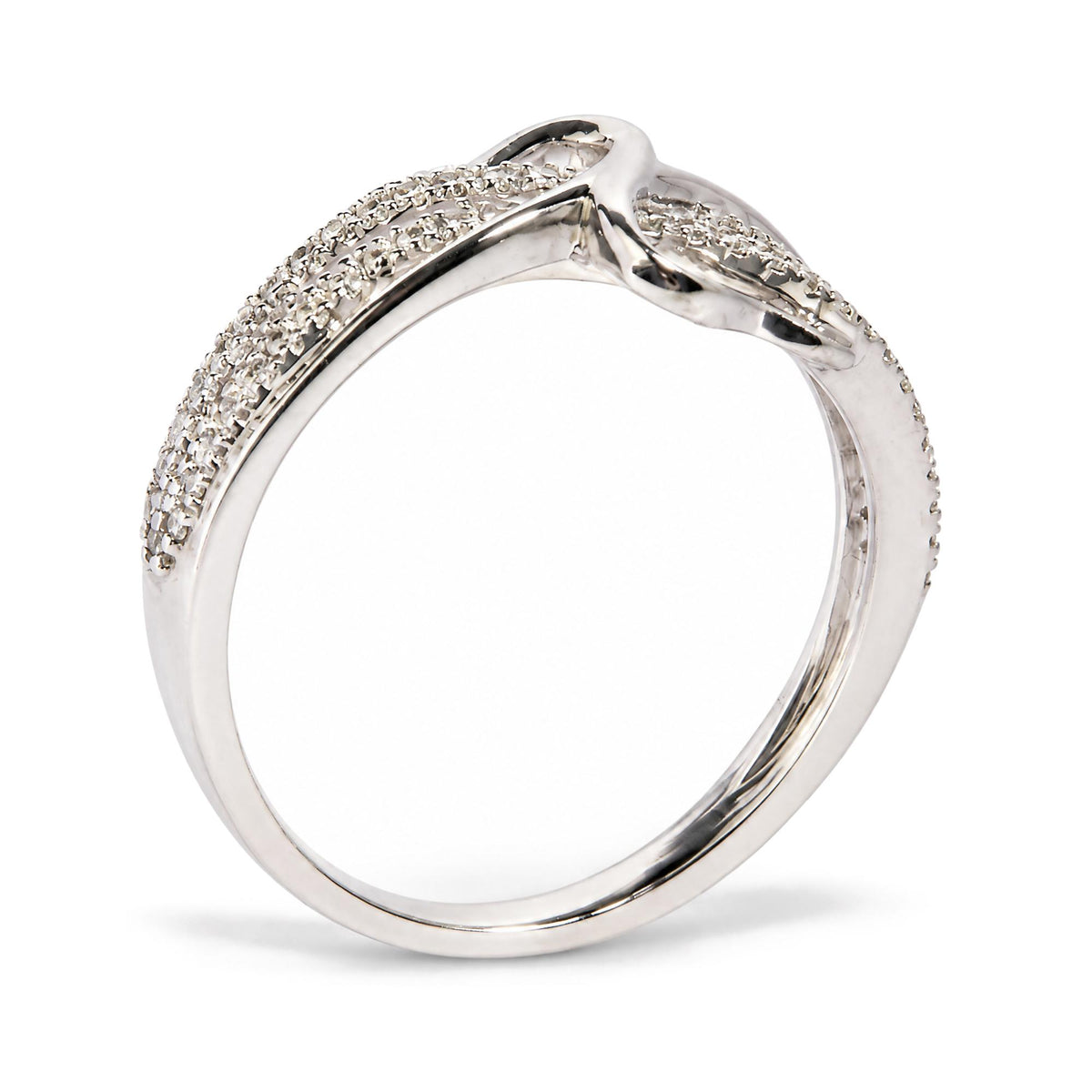 Close-up side angle of a white metal ring featuring a twisted design with multiple rows of round white gemstones in prong settings.