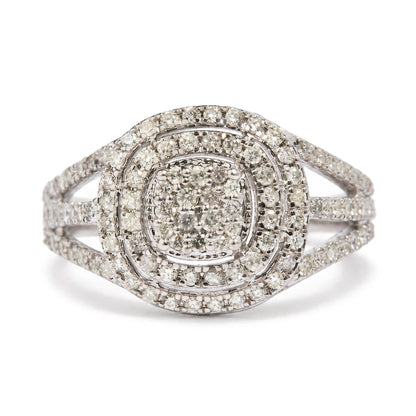 Close-up front angle of a white metal ring featuring multiple rows of round white gemstones in prong settings arranged in a concentric square and circular pattern.
