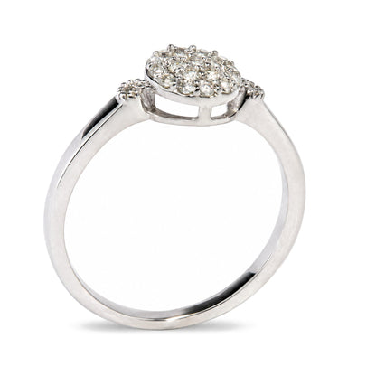 Close-up front angle of a white metal ring featuring a cluster of round white gemstones in prong settings on the top.