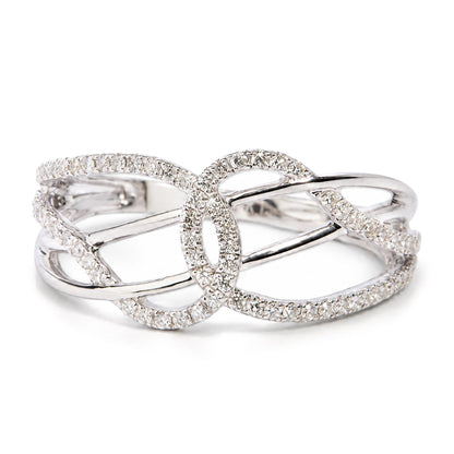 Close-up front angle view of a white metal ring with an intricate open design, featuring multiple round white gemstones set in prongs across the surface.