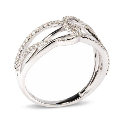 Close-up angled view of a white ring featuring intertwined bands adorned with round white gemstones in prong settings.