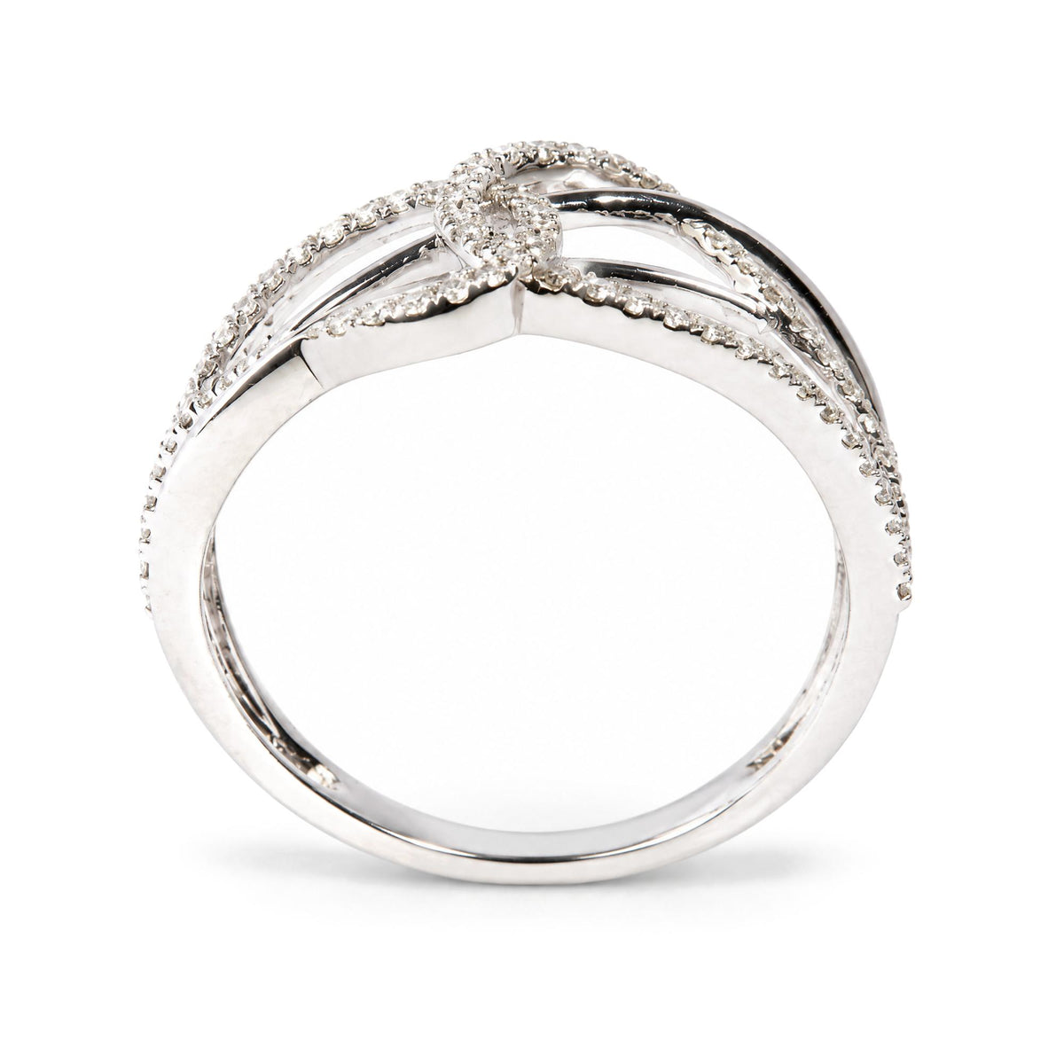 Close-up front angle of a white metal ring featuring multiple rows of round white gemstones in prong settings forming a delicate intertwined design.