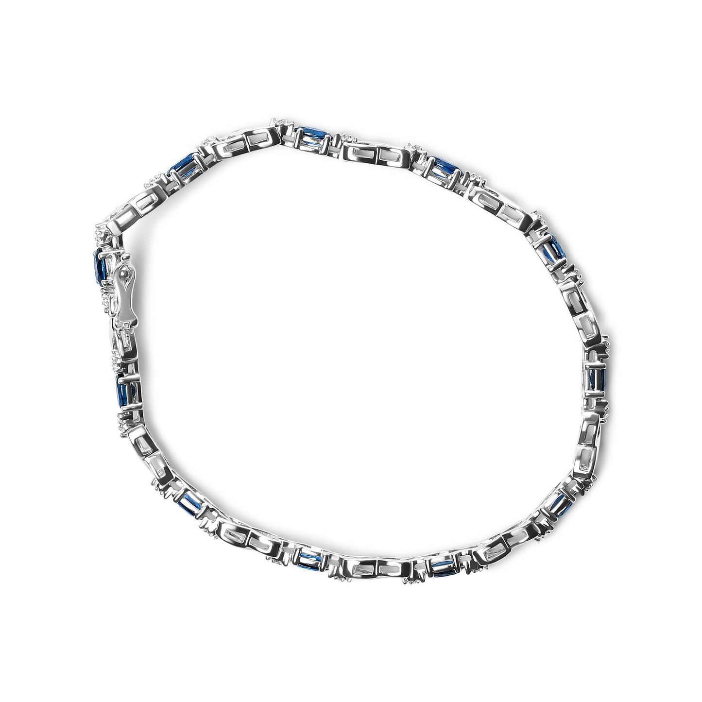Top-down angle of a white metal bracelet featuring alternating oval blue gemstones and round white gemstones in prong settings.
