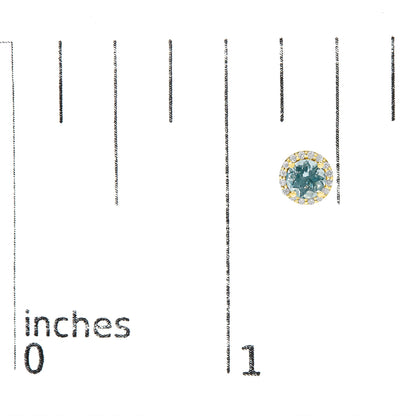 Single yellow metal earring with a round blue gemstone center surrounded by a circle of small white gemstones, shown on a scale image from front angle.