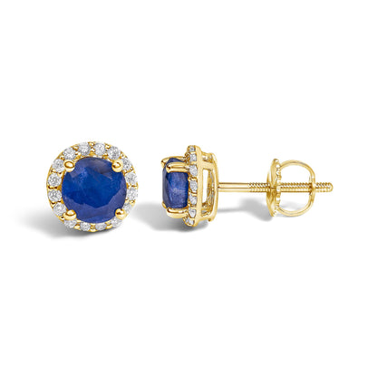 Front and side views of yellow metal stud earrings featuring round blue gemstones in four-prong settings surrounded by a halo of round white gemstones in shared prong settings, shown on a white background.