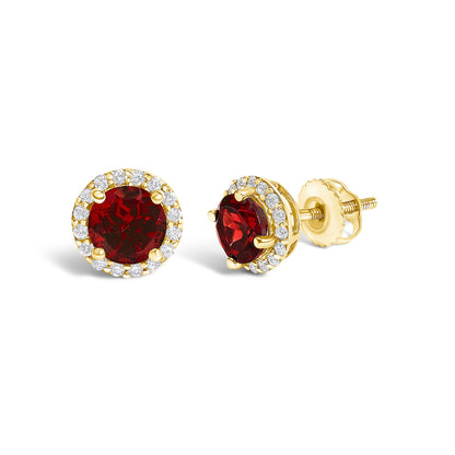 Pair of yellow metal stud earrings shown from front and side angles, each featuring a round red gemstone center surrounded by smaller round white gemstones in a shared prong setting.