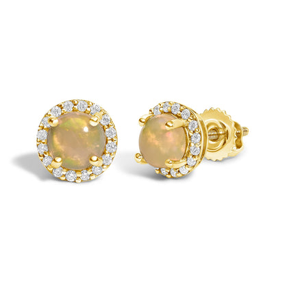 Close-up front and side angle view of yellow metal stud earrings featuring a round multi-color opal gemstone in a four-prong setting, surrounded by a halo of round white gemstones in a shared prong setting.