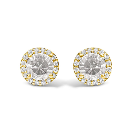 Front angle close-up of round yellow metal stud earrings with a larger round white gemstone center surrounded by a circle of smaller round white gemstones in shared prong settings.