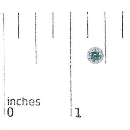 Close-up front view of a white metal round earring with a central blue gemstone and surrounding white gemstones, shown on a scale with inch markings.