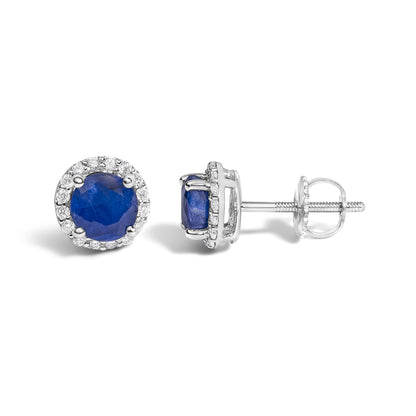Close-up front and side view of white stud earrings featuring a large round blue gemstone center surrounded by a halo of small round white gemstones in shared prong settings. The image shows one earring facing forward and the other sideways, revealing the screw-back fastening.
