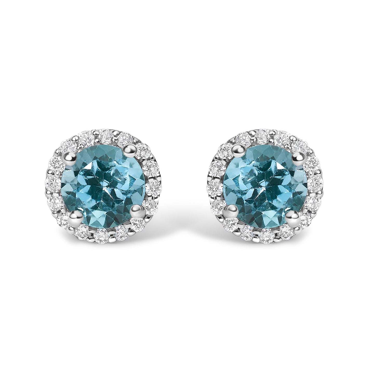 Pair of white metal round stud earrings with central blue round gemstones and surrounding white round gemstones in shared prong setting, shown in a front-facing angle.