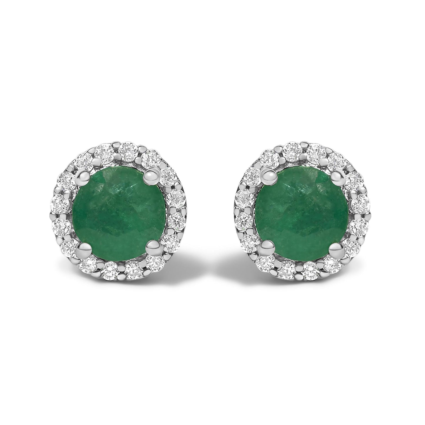 Front view of a pair of white metal stud earrings featuring round green gemstones in four-prong settings, each surrounded by a halo of small round white gemstones in shared prong settings.
