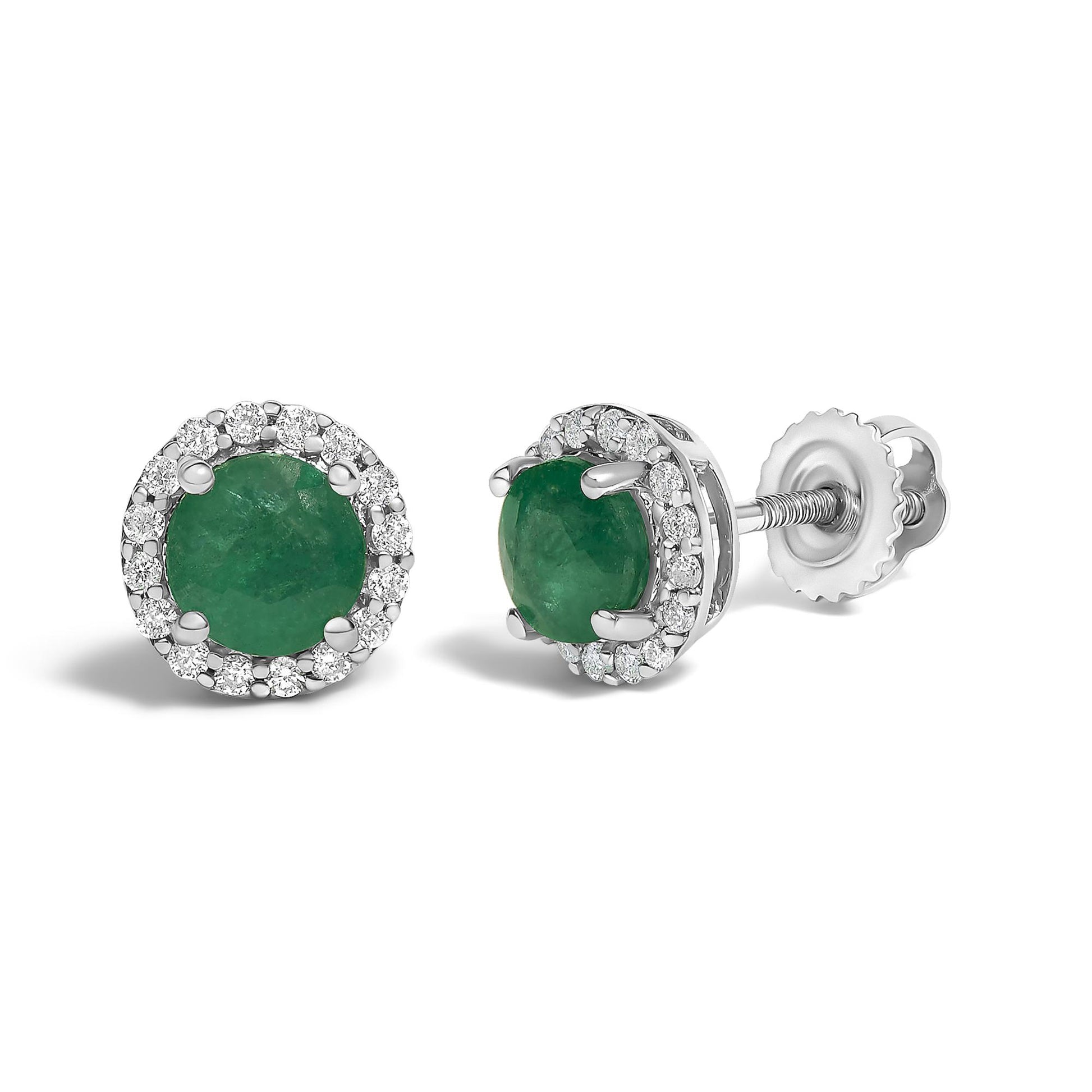 Pair of white metal stud earrings with round green gemstones in the center, surrounded by a halo of small round white gemstones, shown from a front and angled side view on a white background.