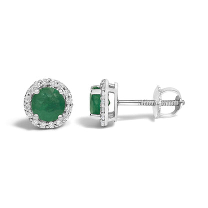 Pair of white metal stud earrings with a round green gemstone center surrounded by a halo of small round white gemstones, shown in a front and side angle on a white background.