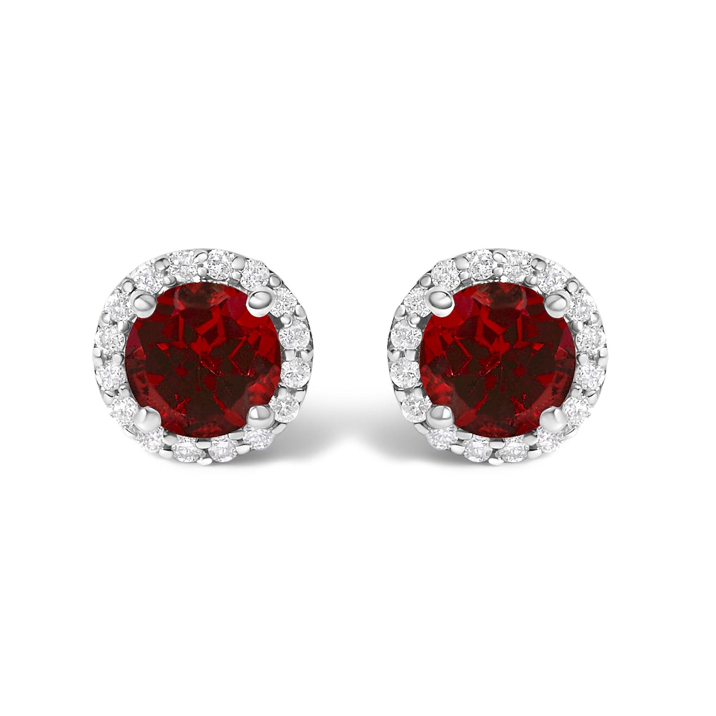 Pair of round stud earrings with red gemstones in the center, surrounded by a halo of white gemstones, shown in a front-facing close-up view.