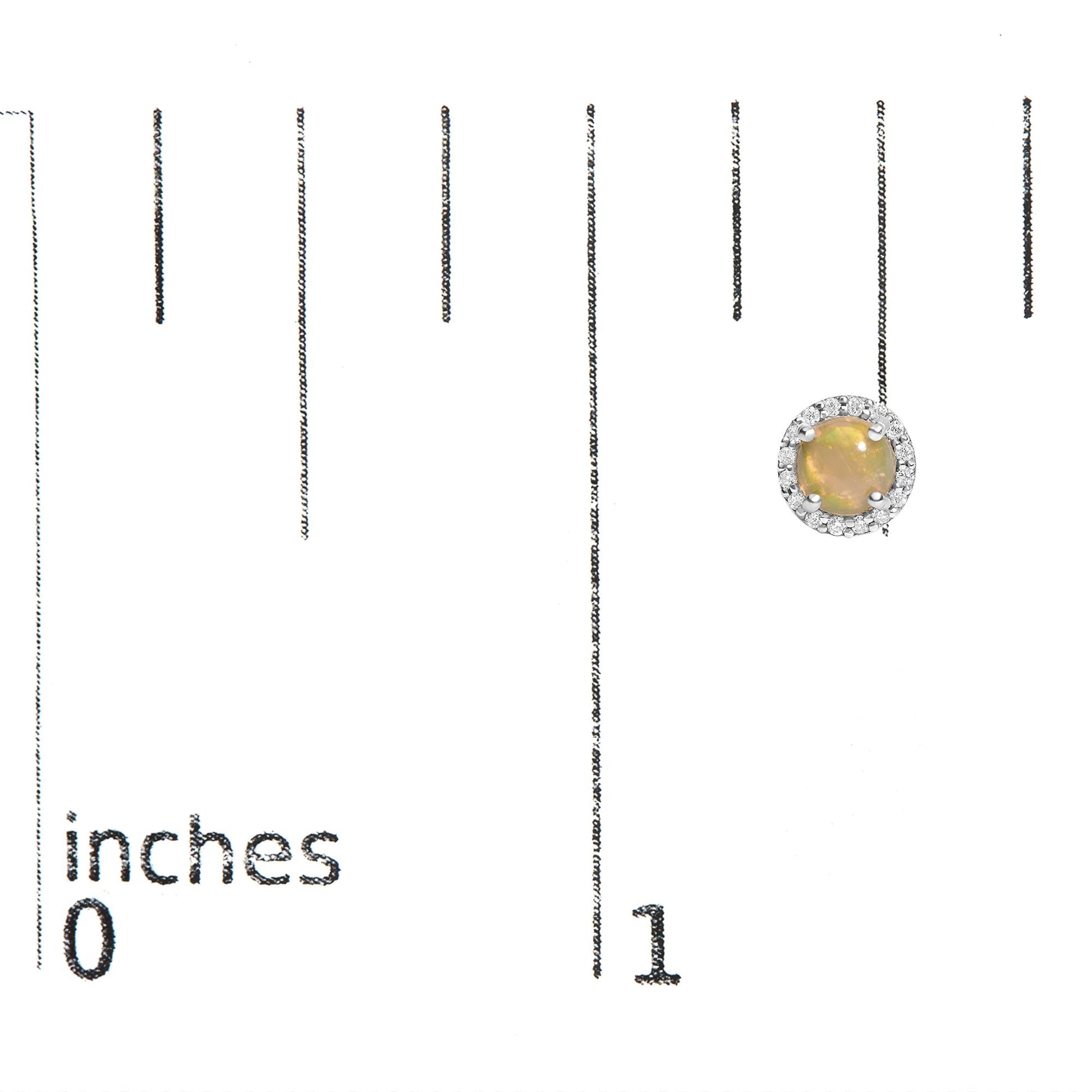 Single round white metal earring with a central multi-color round gemstone set in four prongs, surrounded by a halo of white round gemstones, shown on a scale with inch markings from a top front angle.