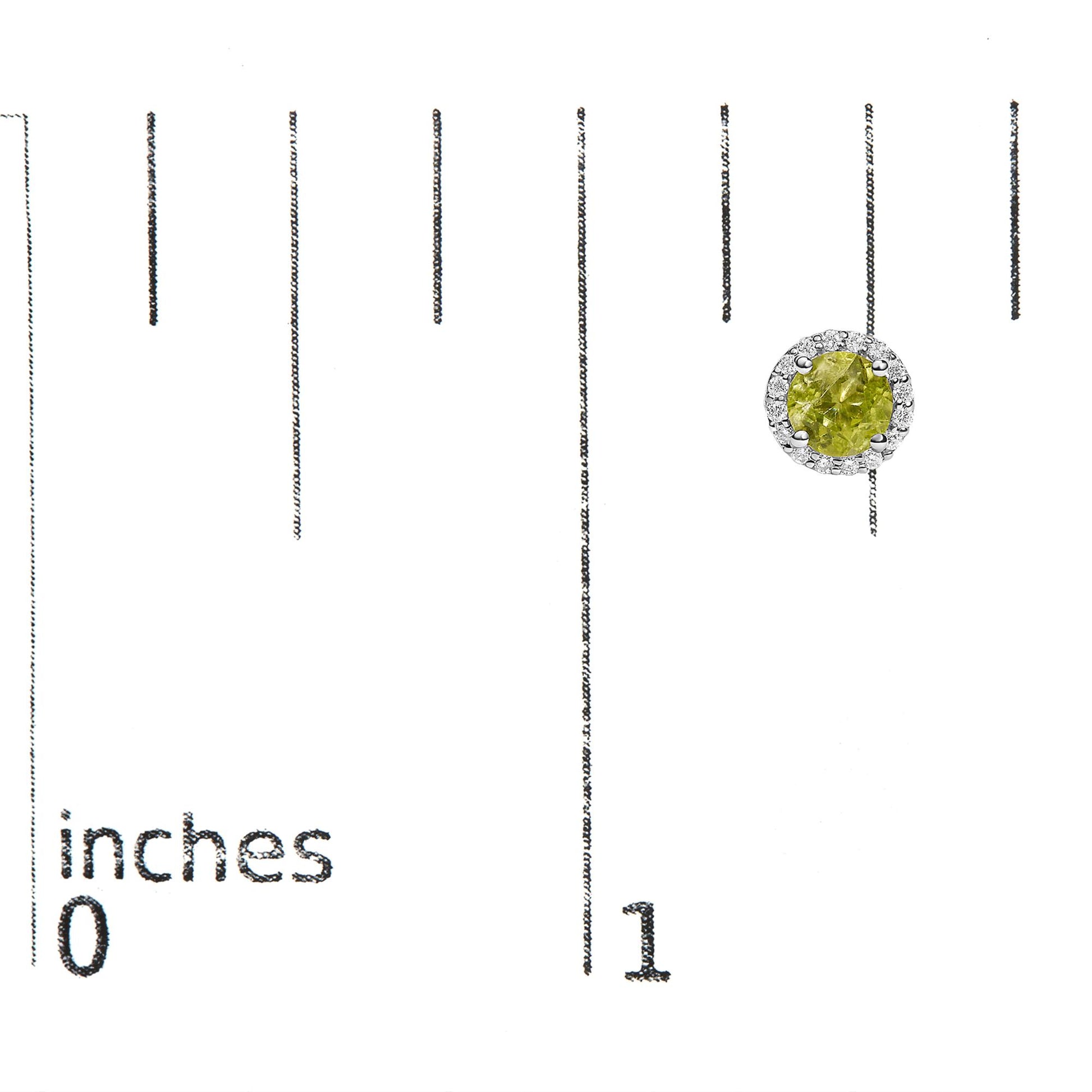 Single white metal round earring shown on a scale, featuring a central round green gemstone in a prong setting, surrounded by small round white gemstones in a shared prong setting, viewed from the front.